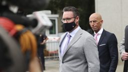 Trevor Milton, founder of Nikola Corp., center, exits federal court in New York, U.S., on Thursday, July 29, 2021. Milton is charged with misleading investors from November 2019 until around September 2020 about the development of Nikolas products and technology, according to an indictment unsealed Thursday by federal prosecutors in N.Y.