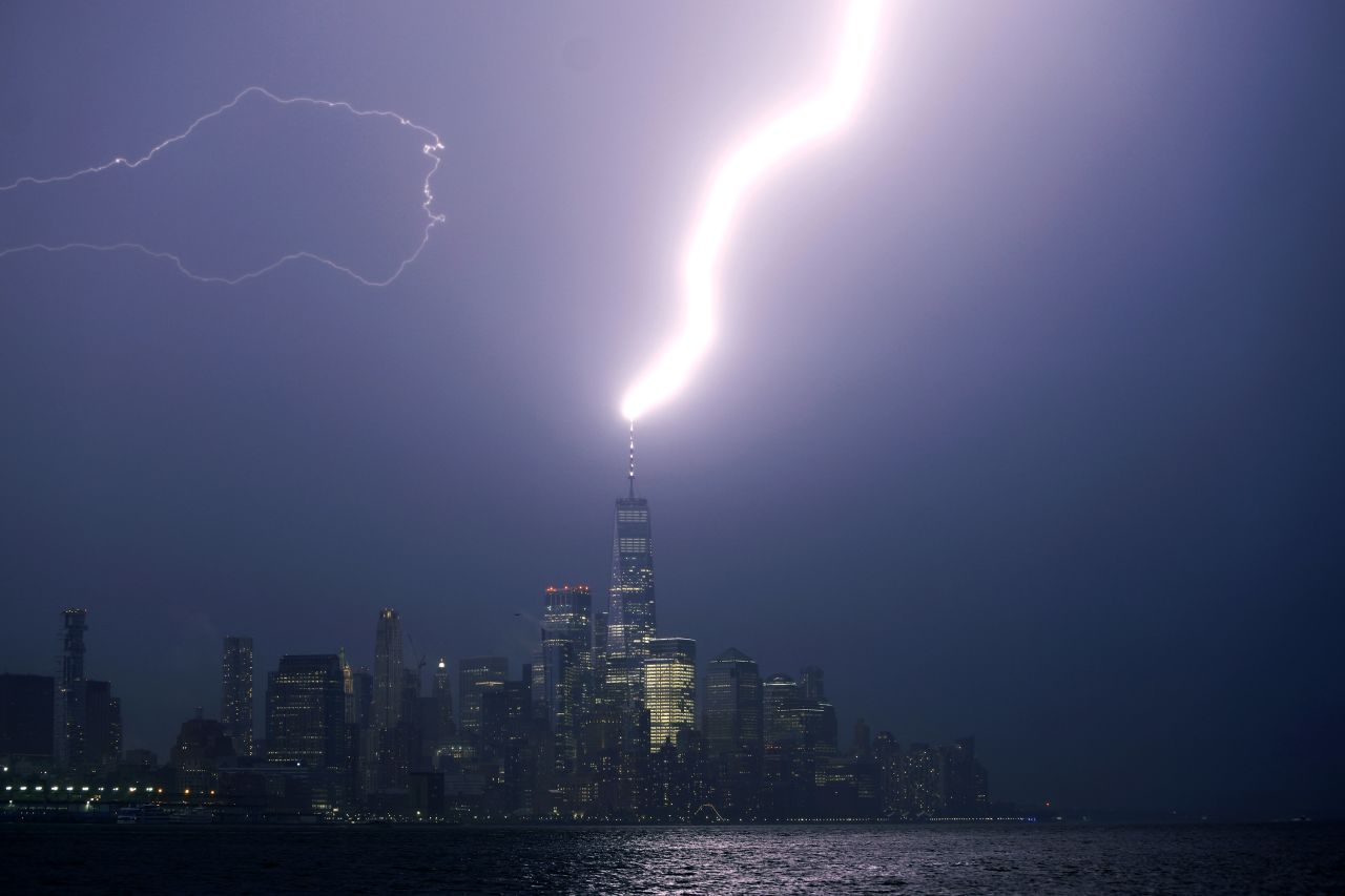 A lightning bolt strikes One World Trade Center as a thunderstorm passes through New York City on Tuesday, August 10.