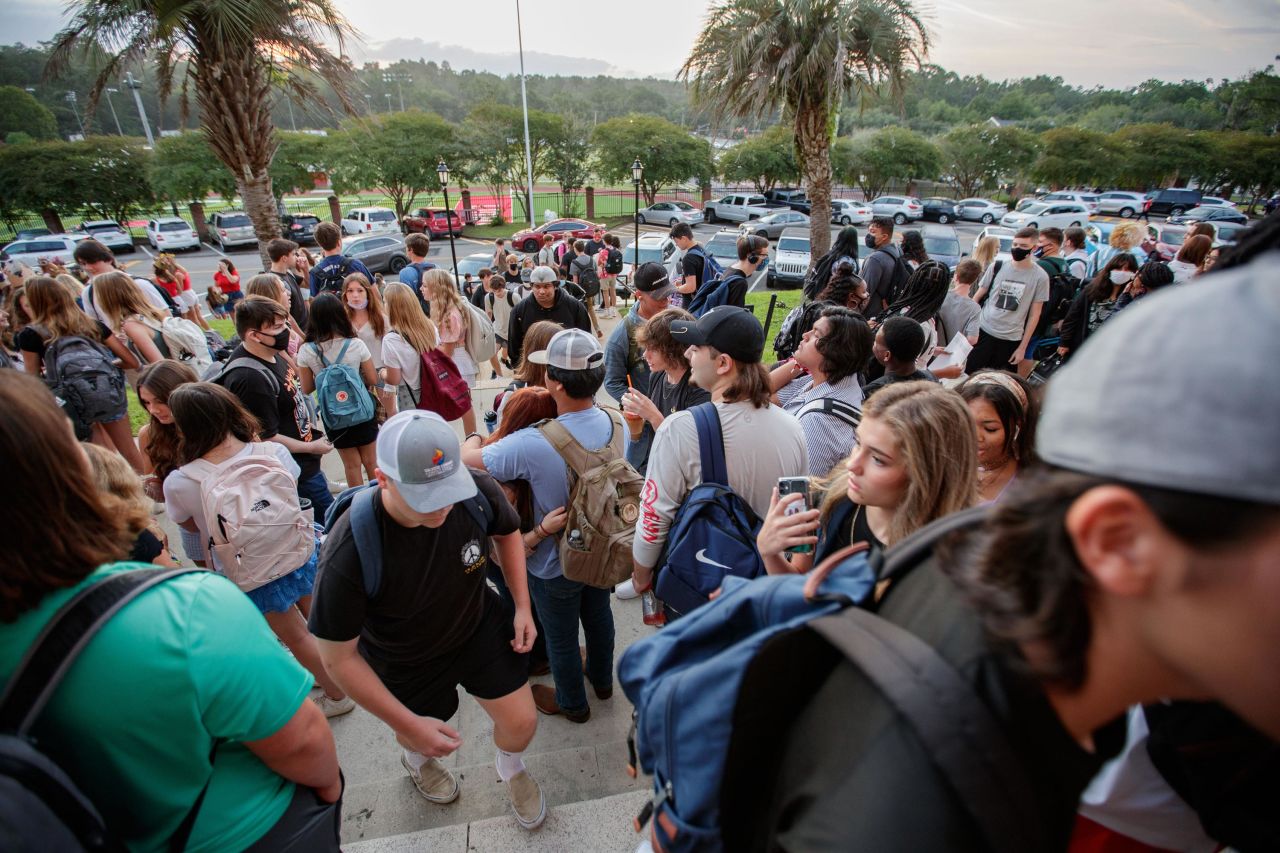 Students from Leon High School gather outside the school's main building in Tallahassee, Florida, before the first day of classes on Wednesday, August 11.
