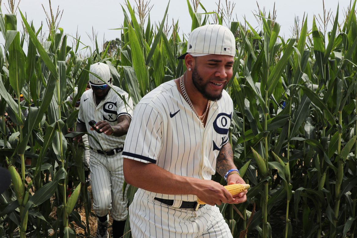 Yoán Moncada, a third baseman with the Chicago White Sox, holds corn in his hands before the <a href="https://www.cnn.com/travel/article/field-of-dreams-stadium-iowa/index.html" target="_blank">"Field of Dreams" baseball game</a> in Dyersville, Iowa, on Thursday, August 12. It was the first official Major League Baseball game in the state of Iowa, and it was played on a specially built field next to the original "Field of Dreams" movie site.