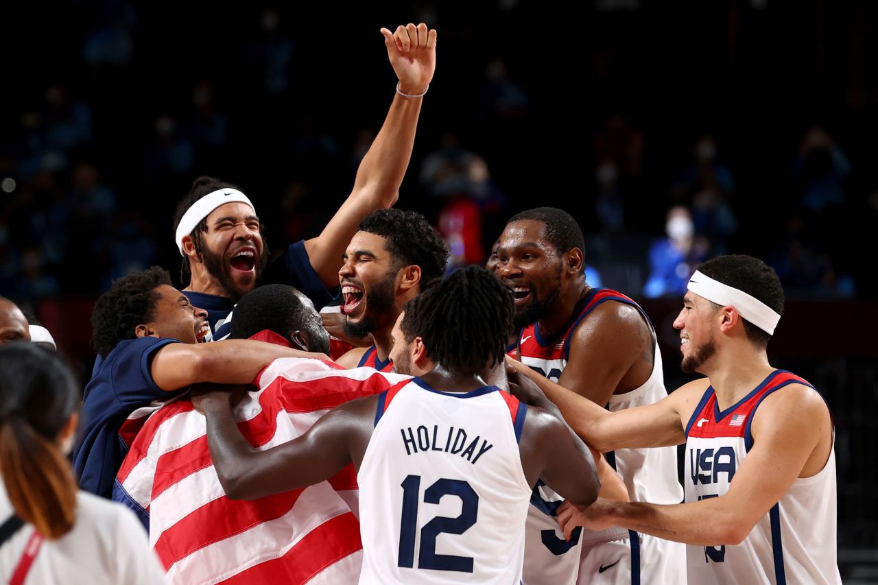 US basketball players celebrate <a href="https://www.cnn.com/world/live-news/tokyo-2020-olympics-08-07-21-spt/h_fbb5e6e6f9790e71f12c0994183a4819" target="_blank">after defeating France in the gold-medal game</a> at the Olympics on Saturday, August 7. It's the Americans' fourth straight gold in men's basketball.