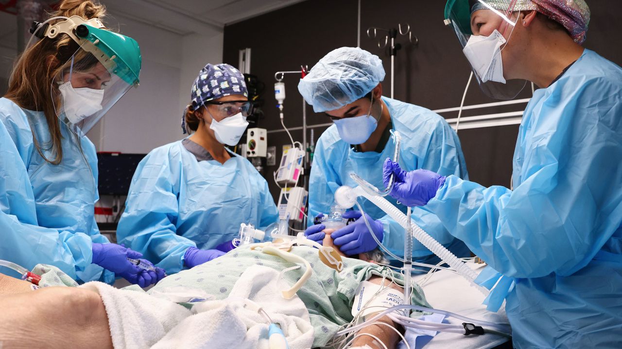 Clinicians work on intubating a Covid-19 patient Tuesday in the intensive care unit at Lake Charles Memorial Hospital in Lake Charles, Louisiana, Tuesday, August 10.