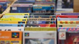 This photo taken on August 12, 2017 shows game cartridges for the Nintendo Super Famicom, a classic 1990s 16-bit console that was marketed in many regions outside Japan as the Super NES (Nintendo Entertainment System), on sale at a retro gaming expo in Hong Kong. - A group of Japanese retro video game enthusiasts on April 28, 2020 are hoping that lockdown-induced boredom will convert today's teens into fans of yesteryear's games, offering 100 classic Nintendo consoles to cooped-up kids. (Photo by TENGKU Bahar / AFP) (Photo by TENGKU BAHAR/AFP via Getty Images)
