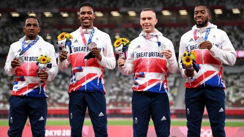 Team GB 4x100m relay athletes pose with their silver medals at the Tokyo Olympics.