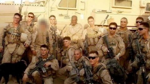 Haji alongside US Marines. (Editor's note: A portion of this photo has been obscured by CNN to protect the individual's identity.)