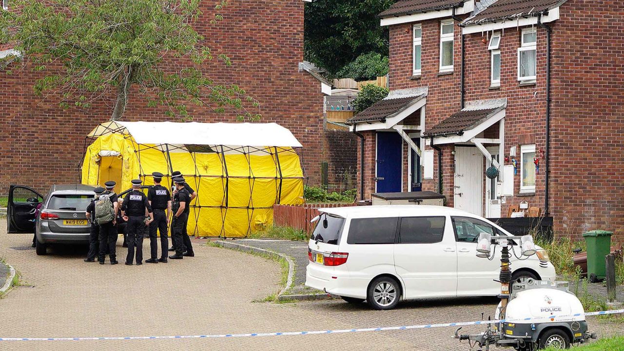 Police at the attack site in Keyham, Plymouth, southwest England, on Friday, the day after the attack.