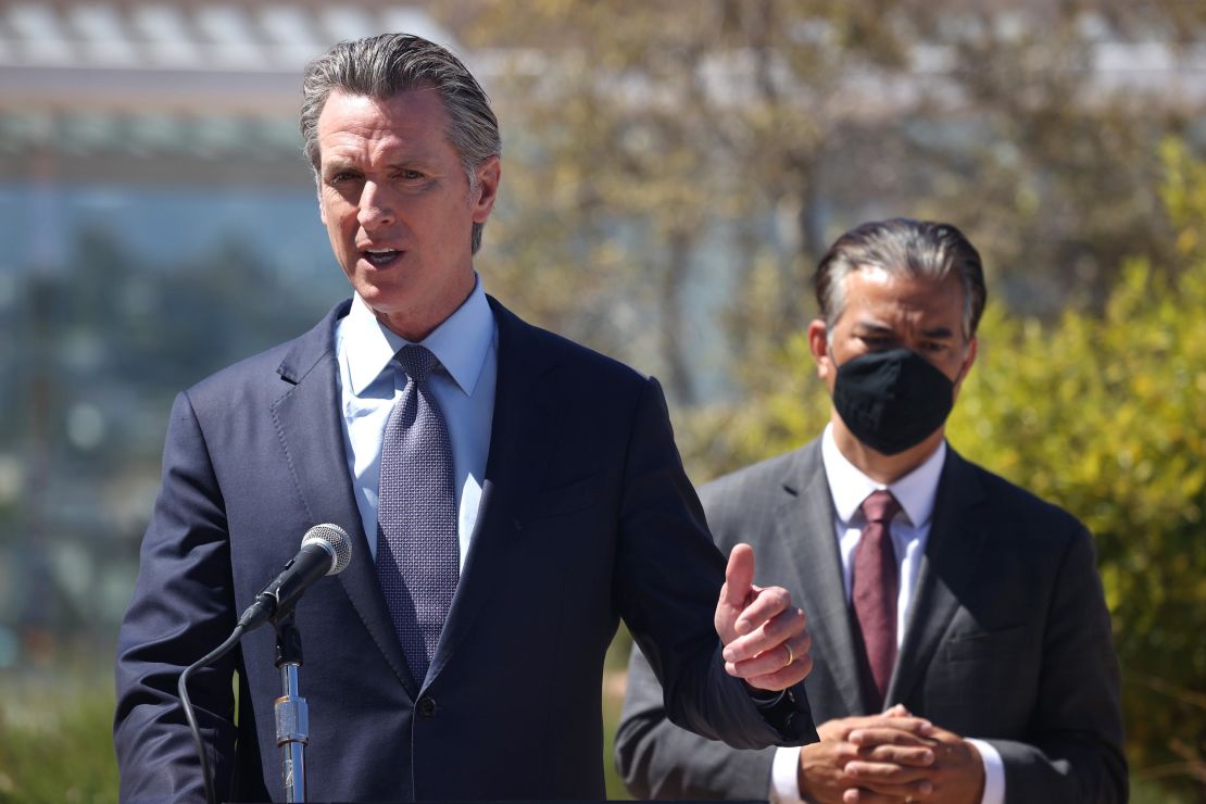 California Gov. Gavin Newsom speaks as California Attorney General Rob Bonta, at right, looks on during a news conference at San Francisco General Hospital on June 10.