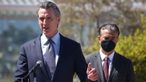 California Gov. Gavin Newsom speaks as California Attorney General Rob Bonta, at right, looks on during a news conference at San Francisco General Hospital on June 10.