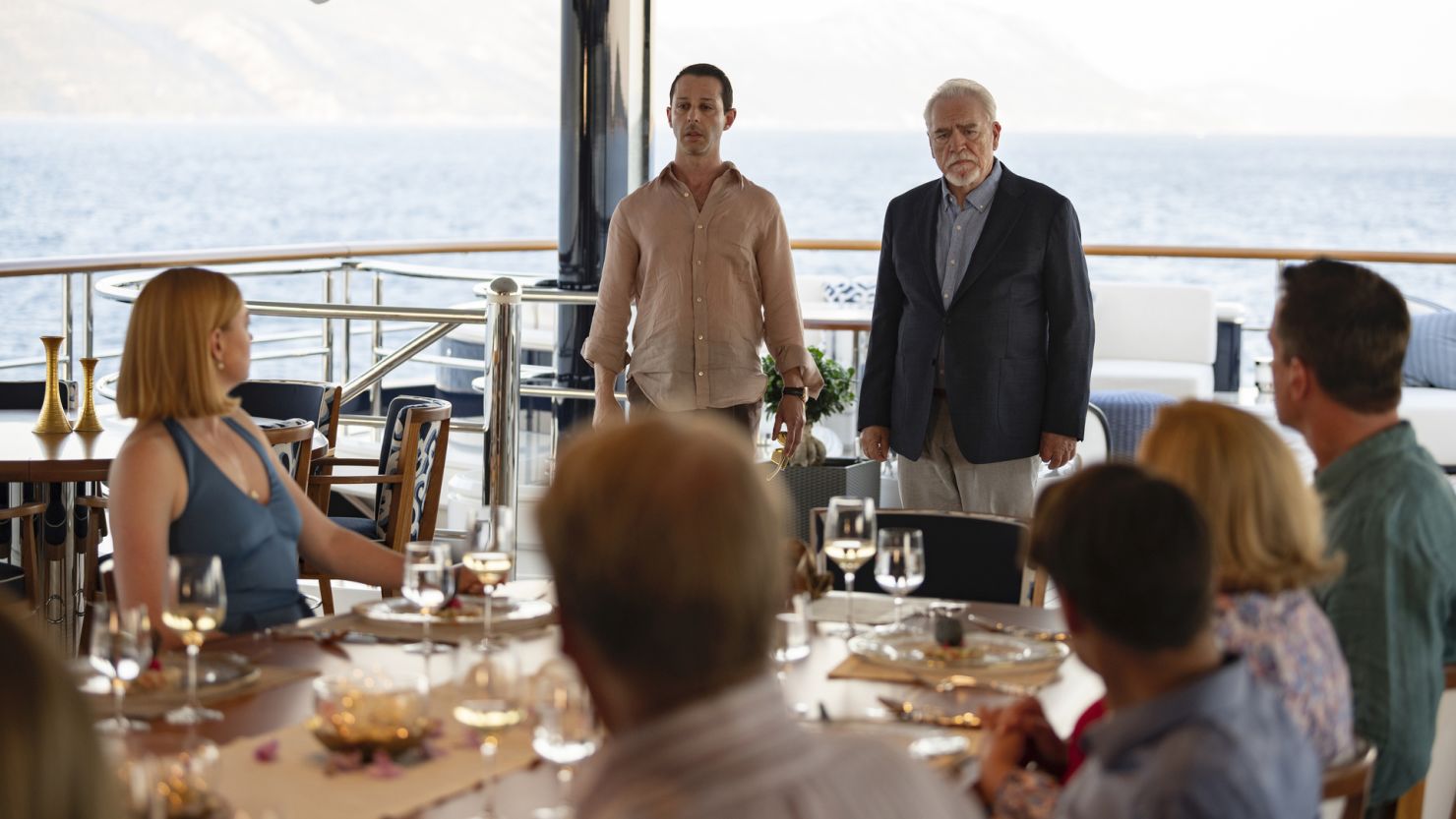 Jeremy Strong as Kendall Roy (center) and Brian Cox as Logan Roy (right) star In "Succession." 