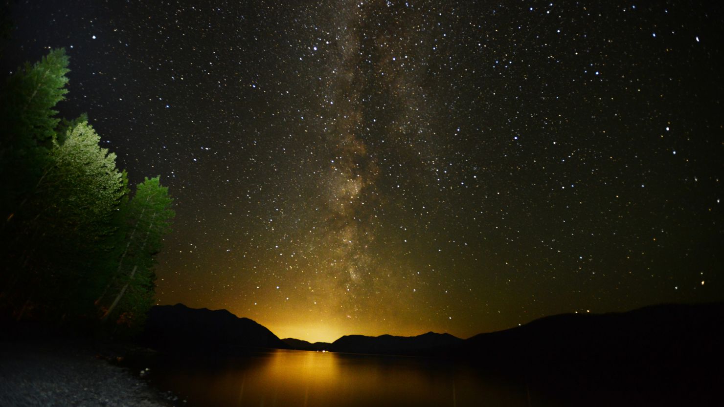 The Milky Way lights up the sky just after 3 a.m. on Thursday, July 18, 2013 over Lake McDonald in Glacier National Park, Montana.
