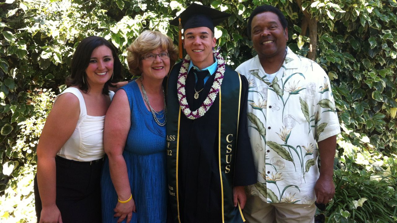 Sarah Gaither, left, and her parents Kathy and Clifford pose with her brother Adam who graduated college in 2012.