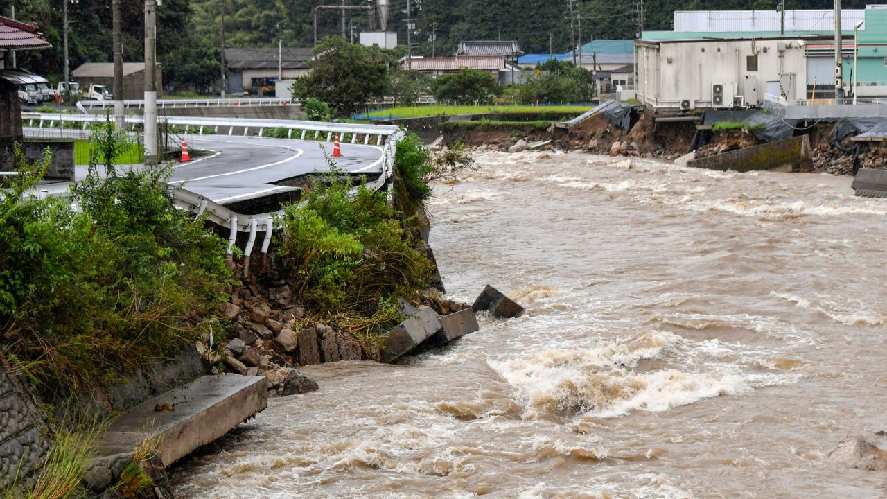 A road damaged by the swollen Suzuhari river in heavy rain in Hiroshima, Japan, on August 13.