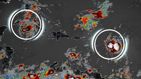 Tropical Depression Fred, circled on the left, and Tropical Storm Grace at right. 