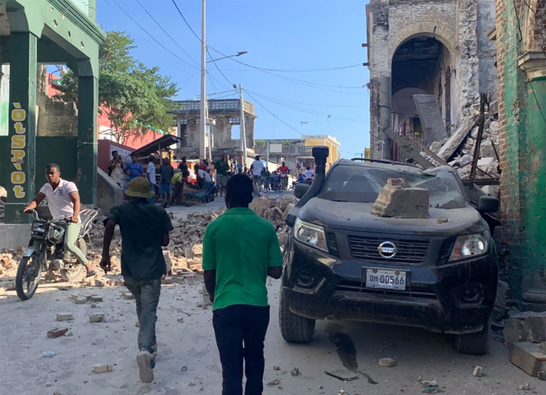 Buildings and cars were damaged in Les Cayes, Haiti.