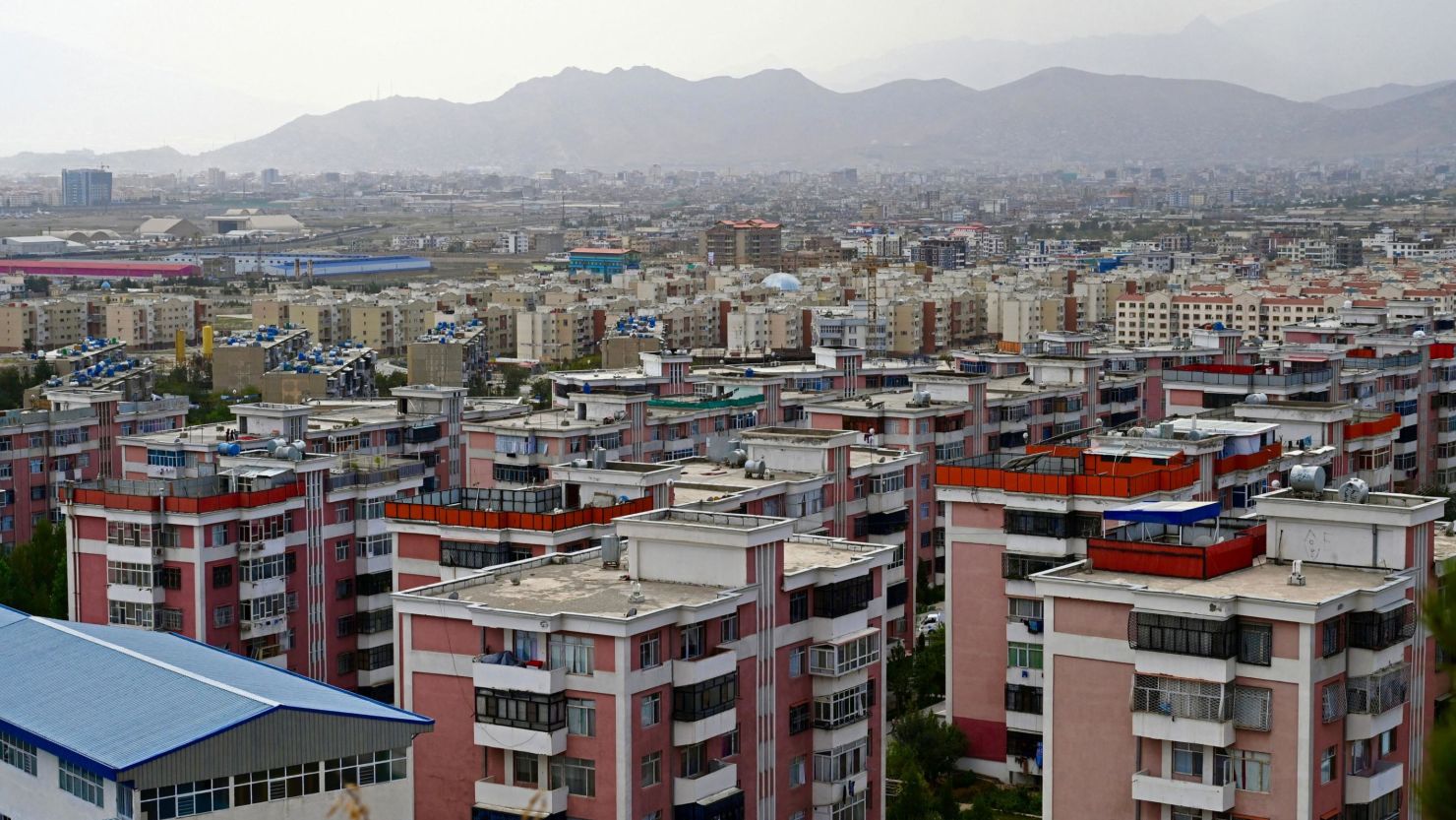 This picture taken from a hilltop shows a general view of residential buildings in Kabul on August 14, 2021.