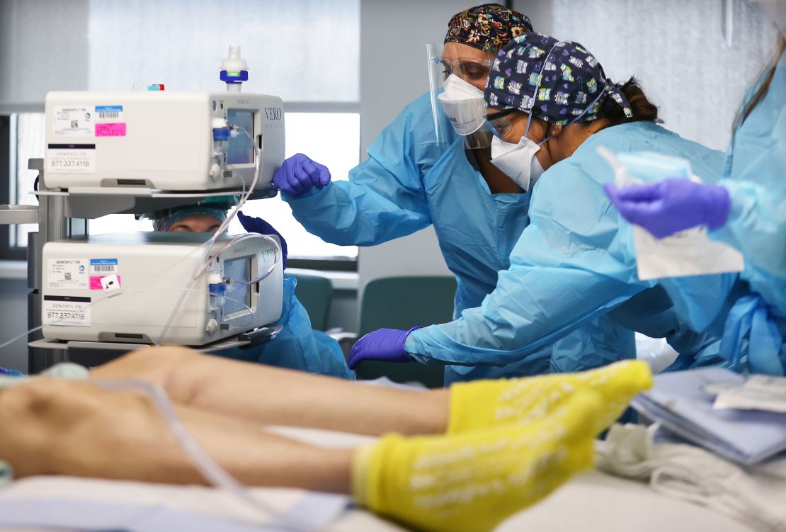 Clinicians work on intubating a COVID-19 patient in the Intensive Care Unit (ICU) at Lake Charles Memorial Hospital on August 10, 2021 in Lake Charles, Louisiana.