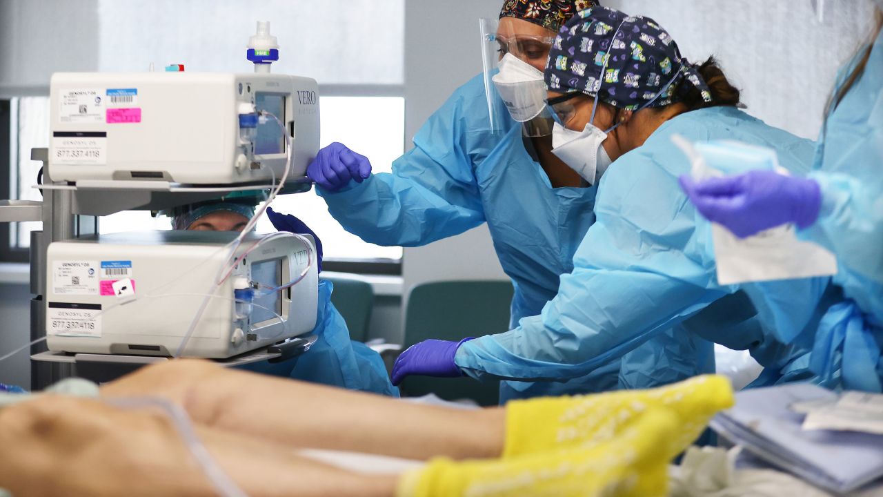 Clinicians work on intubating a COVID-19 patient in the Intensive Care Unit (ICU) at Lake Charles Memorial Hospital on August 10, 2021 in Lake Charles, Louisiana. 