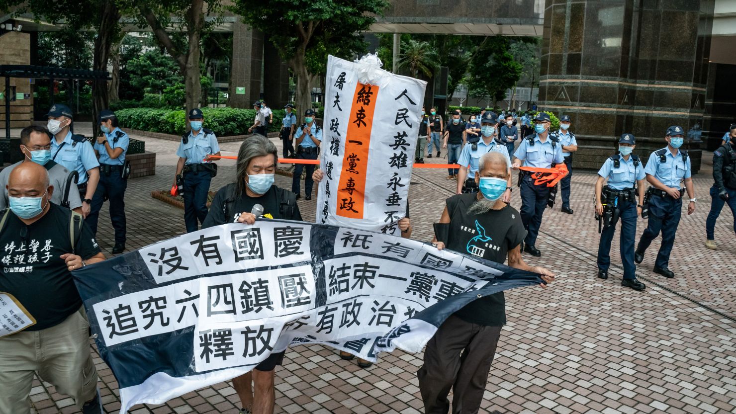 Members of the pro-democracy group Civil Human Rights Front take part in a march toward the flag raising venue ahead of the National Day ceremony on October 1, 2020, in Hong Kong.