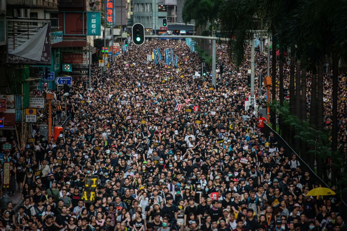 Demonstrators march during the Civil Human Rights Front march in Wan Chai, Hong Kong, on Sunday, July 21, 2019.