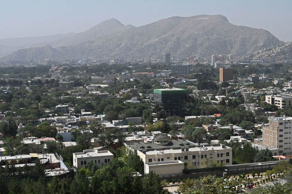 This picture taken from the top of a hillside shows a general view of Kabul on August 15.