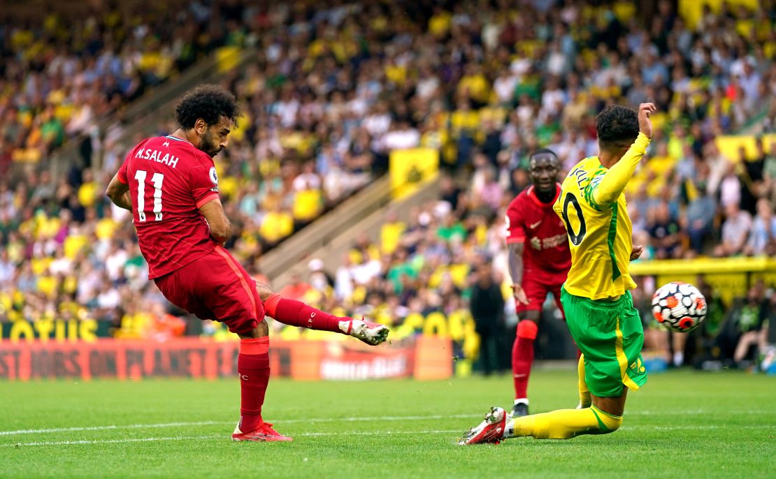 Liverpool's Mohamed Salah scores his side's third goal of the game in the 3-0 win against Norwich.