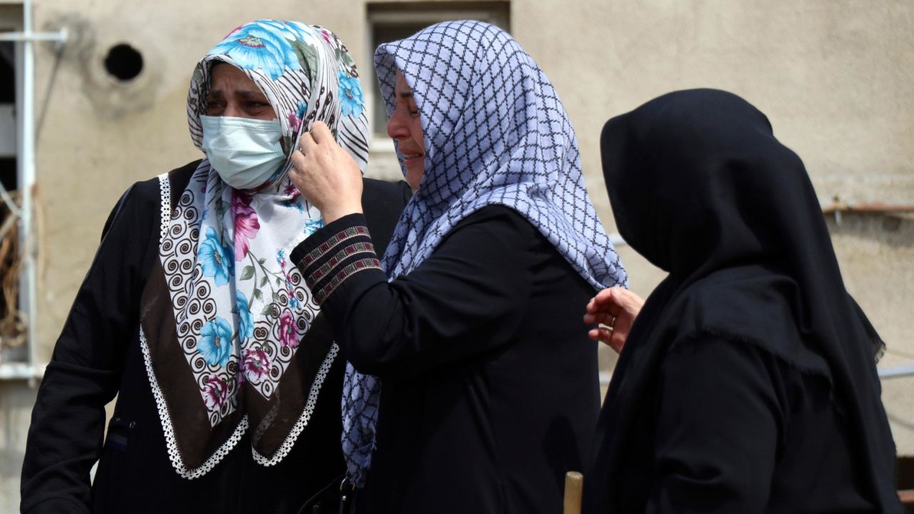 Women react as they look at the destroyed building in Bozkurt town on Saturday.