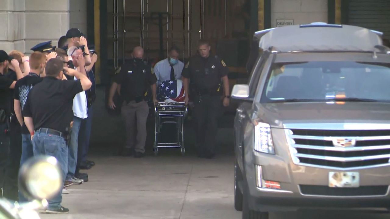 Deputy Ryan Proxmire's body leaves the hospital Sunday.