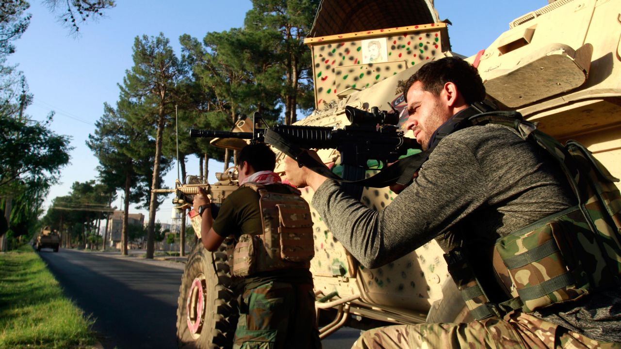Afghan security personnel take a position during fighting between Taliban and Afghan security forces in Herat province, west of Kabul, Afghanistan, on August 3, 2021.