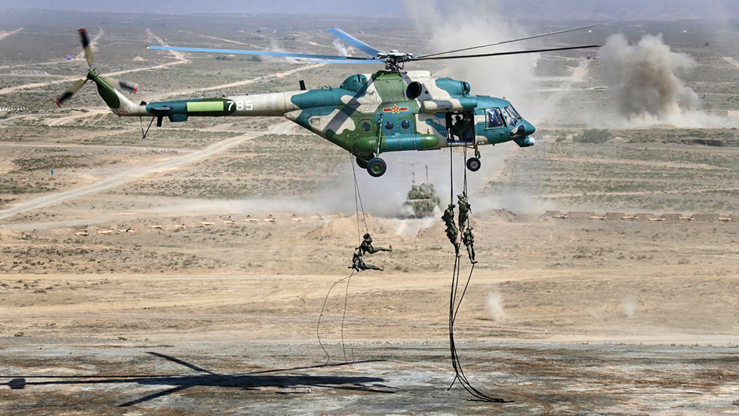 Troops disembark from a Chinese military helicopter during joint war games held by Russia and China held in the Ningxia Hui Autonomous Region in northwestern China on Friday.