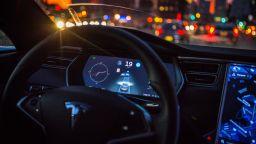 An instrument panel with the Tesla Motors Inc. 8.0 software update illustrates the road ahead using radar technology inside a Model S P90D vehicle in the Brooklyn borough of New York, U.S., on Tuesday, Sept. 20, 2016. The latest overhaul of the car's operating system, known as Tesla 8.0, biggest change is how Autopilot shifts towards a heavier reliance on its radar than its camera to guide the car through traffic. 