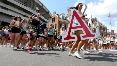 New sorority sisters run to their houses at the University of Alabama after receiving their bids on Sunday. The highs and heartbreaks of "RushTok" dominated TikTok this month. 
