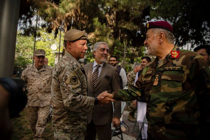 US Gen. Austin S. Miller, left, greets Gen. Bismillah Khan Mohammadi, Afghanistan's defense minister, during a change-of-command ceremony in Kabul on July 12. Miller, the top American general in Afghanistan, was stepping down, a symbolic moment as the United States neared the end of its <a href="index.php?page=&url=http%3A%2F%2Fwww.cnn.com%2F2021%2F04%2F14%2Fmiddleeast%2Fgallery%2Fafghanistan-war%2Findex.html" target="_blank">20-year-old war in the country.</a>