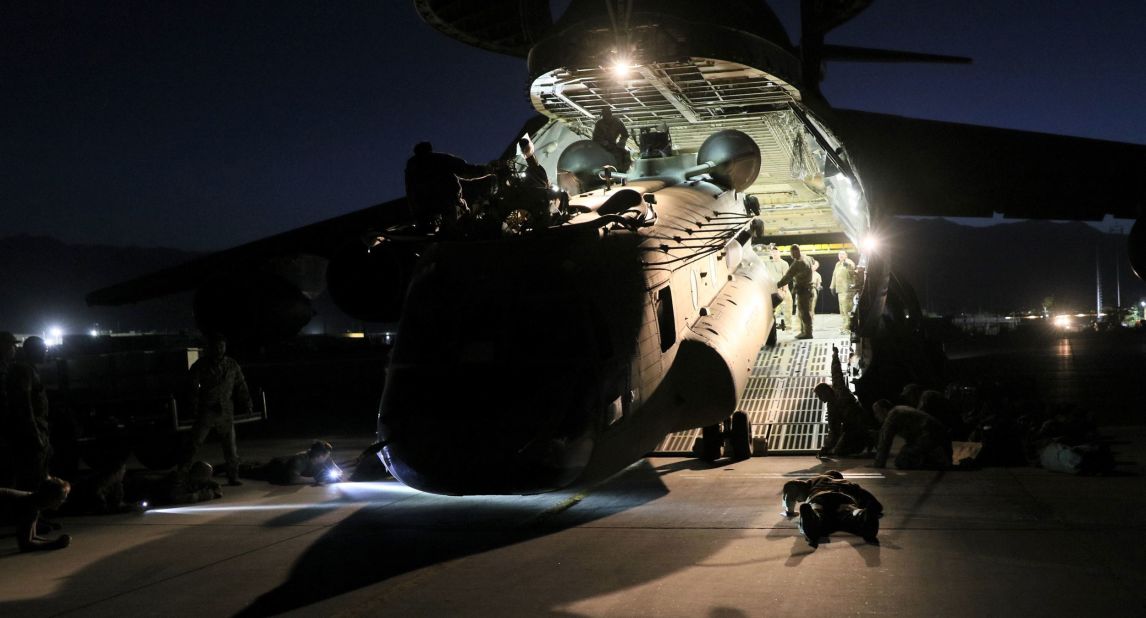 A helicopter is loaded onto a US Air Force plane as American forces carry out their withdrawal from Afghanistan on June 16. 