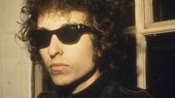 1966:  A headshot of American singer Bob Dylan wearing sunglasses, London, England.  (Photo by Blank Archives/Getty Images)