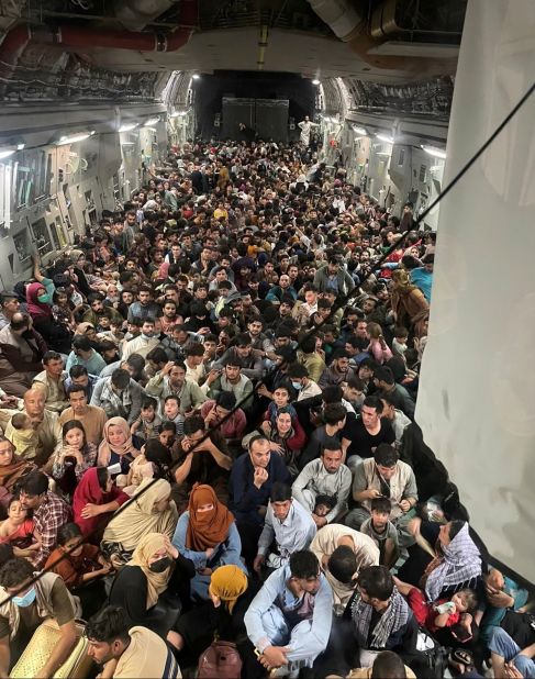 Evacuees crowd the interior of a US Air Force transport plane as they travel from Kabul to Qatar on August 15.