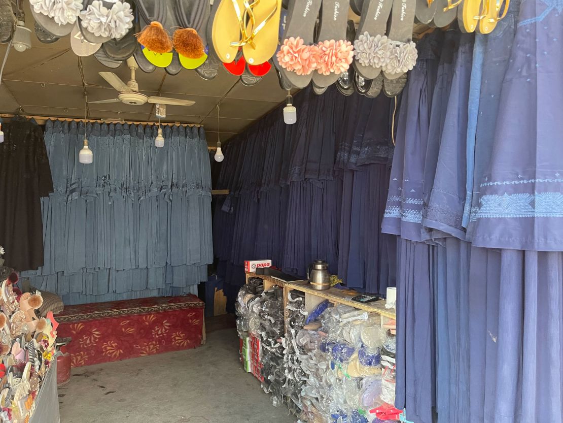 Burqas hang in a market in Kabul on July 31. The price has surged as women rush to cover themselves to avoid attracting the militants' attention.