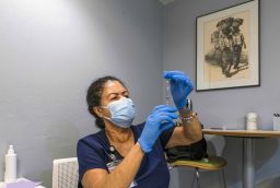 A health care worker prepares a dose of the Pfizer/BioNTech vaccine in Lake Worth, Florida.