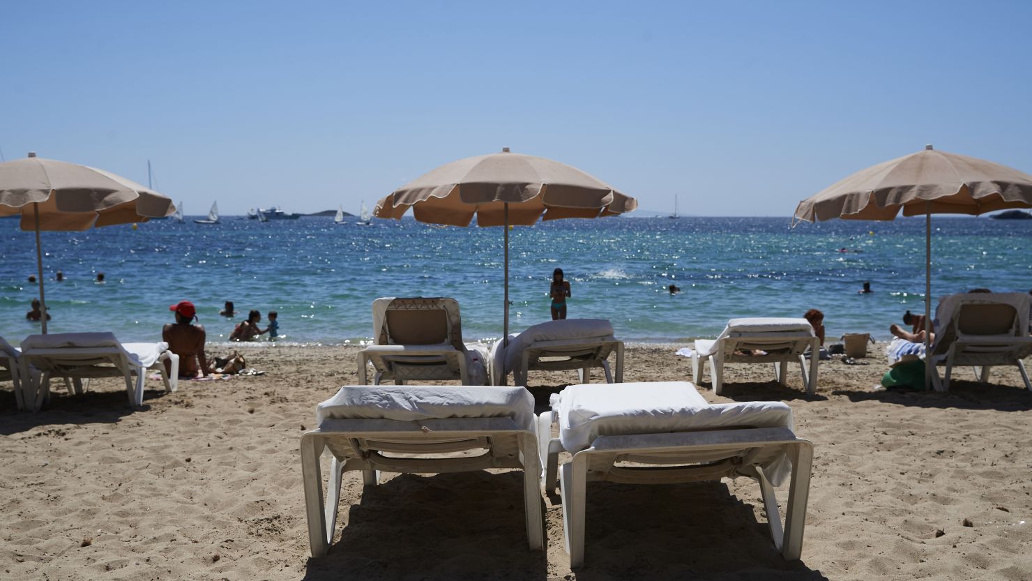 IBIZA, SPAIN - AUGUST 16:  Detail view of the Figueretes beach on August 17, 2020 in Ibiza, Spain. Almost all Schengen countries recommend not traveling to Spain due to COVID -19. The quarantine imposed by the United Kingdom has been decisive, many establishments have not opened and the average occupancy is less than 50%. (Photo by Carlos Alvarez/Getty Images)