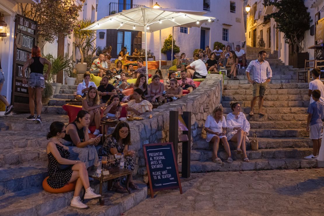 Tourists gather in the Old Town of Ibiza on August 6, 2021.