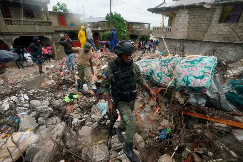 A soldier walks over rubble in Les Cayes, Haiti, on August 17.