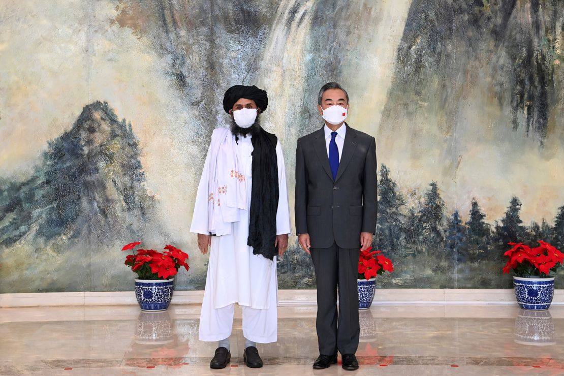 Taliban co-founder Mullah Abdul Ghani Baradar, left, and Chinese Foreign Minister Wang Yi in China on July 28, 2021.