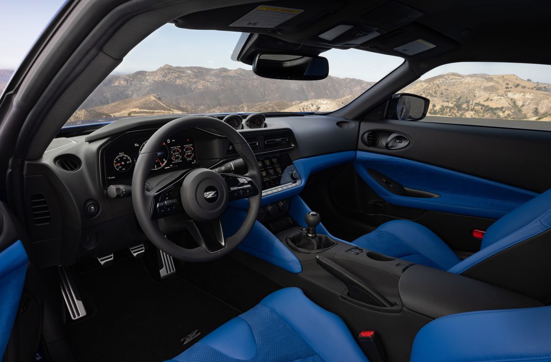 The interior of the new Nissan Z has three analog gauges that, designer Alfonso Albaisa said, are a nod to the car's early roots. The center console has a digital touchscreen, though.