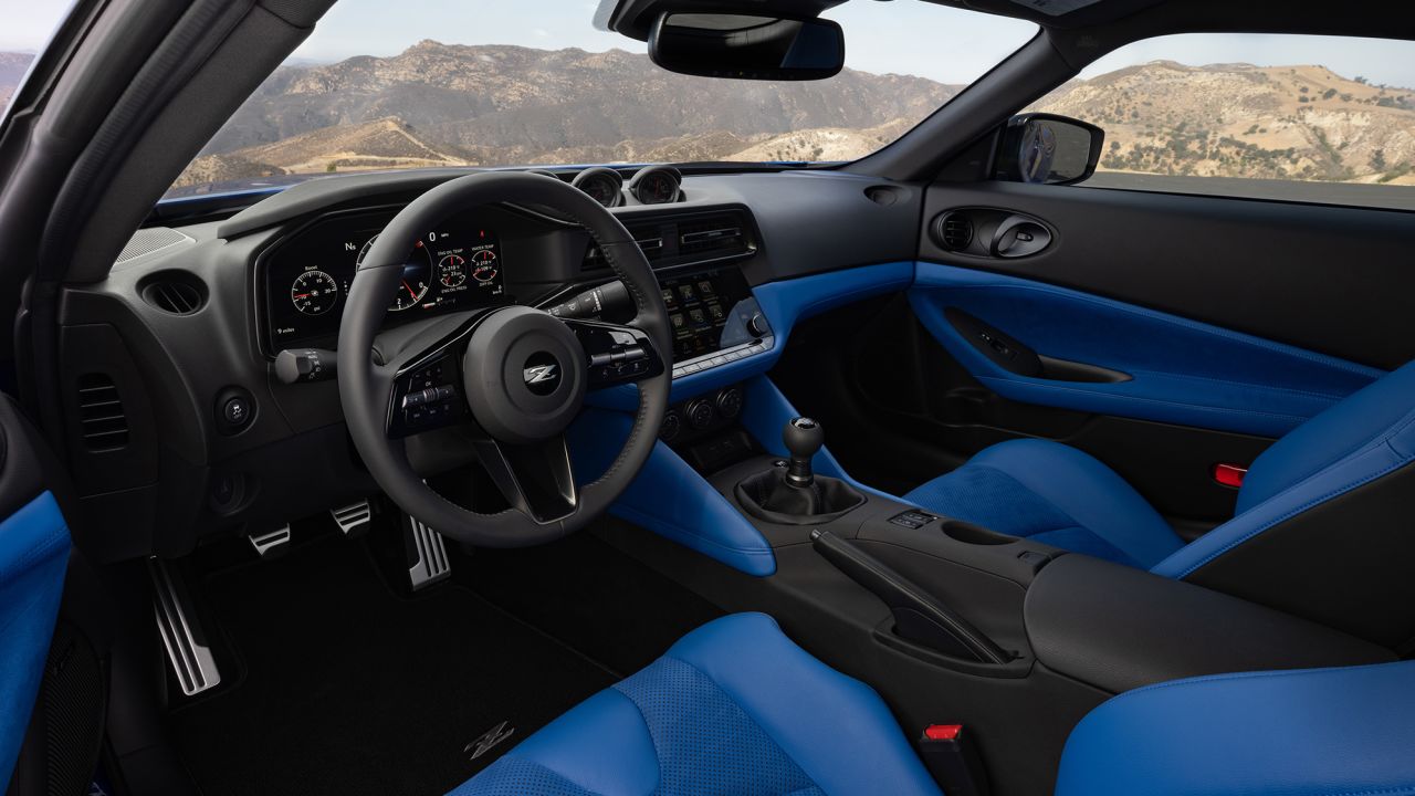 The interior of the new Nissan Z has three analog gauges that, designer Alfonso Albaisa said, are a nod to the car's early roots. The center console has a digital touchscreen, though.