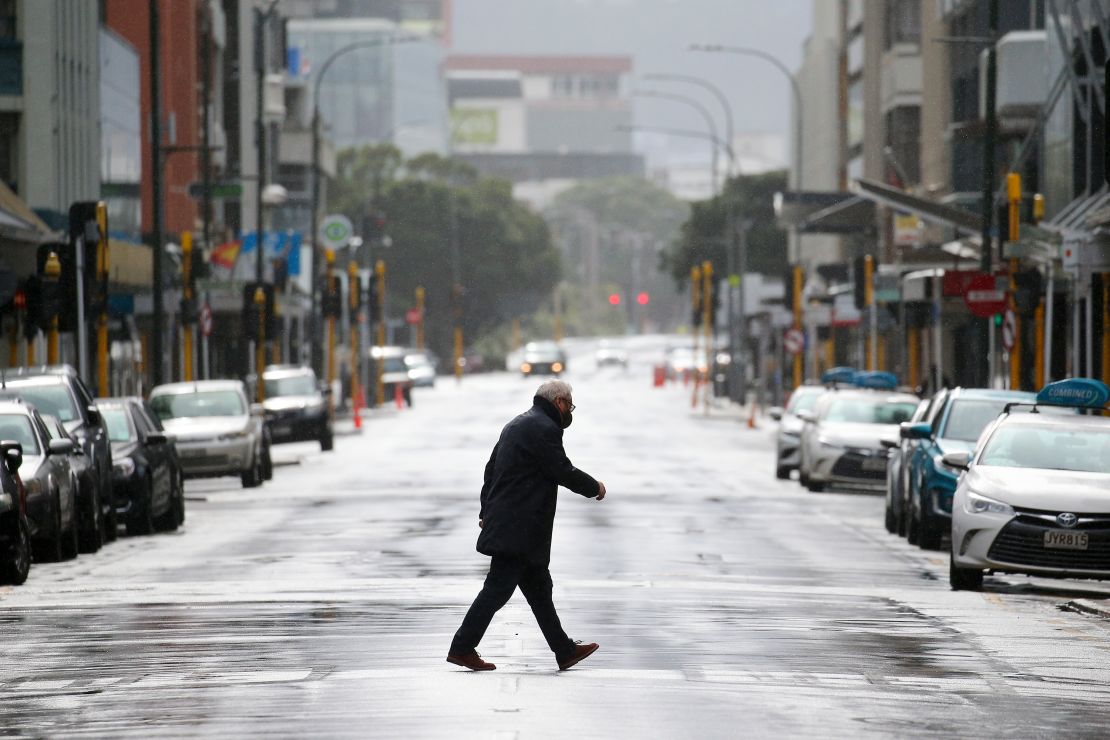A pedestrian crosses Featherston Street during the first day of a national lockdown on August 18, 2021 in Wellington, New Zealand. 