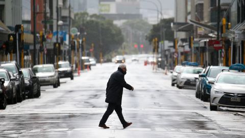 A pedestrian crosses Featherston Street during the first day of a national lockdown on August 18, 2021 in Wellington, New Zealand.