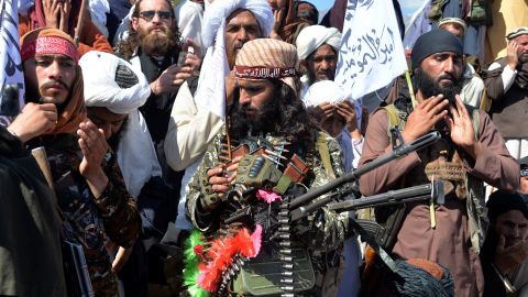 Afghan Taliban militants and villagers attend a gathering as they celebrate the peace deal and their victory in the Afghan conflict on US in Afghanistan, in Alingar district of Laghman Province on March 2, 2020. - The Taliban said on March 2 they were resuming offensive operations against Afghan security forces, ending the partial truce that preceded the signing of a deal between the insurgents and Washington. (Photo by NOORULLAH SHIRZADA / AFP) (Photo by NOORULLAH SHIRZADA/AFP via Getty Images)