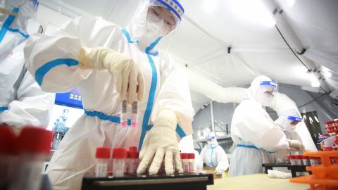 Medical workers testing samples from local residents for Covid-19 at a mobile test lab in Yangzhou, China, on August 17.