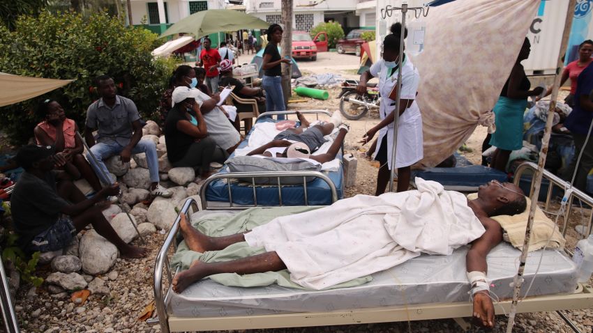 Earthquake victims are assisted in the surroundings of the general hospital due to the lack of available beds in Les Cayes, Haiti, on Aug. 16, 2021. 