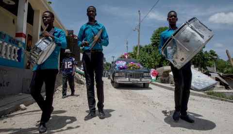 A funeral procession is held for an earthquake victim in L'Asile, Haiti, on Wednesday, August 18.