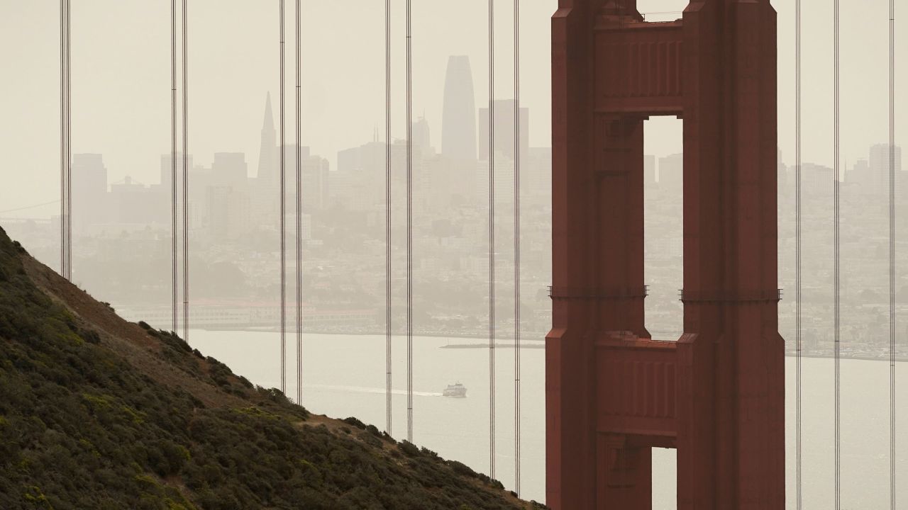 Smoke and haze from wildfires obscure the Golden Gate Bridge and the San Francisco skyline on August 18.